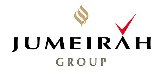 Modern corporate logo of Jumeirah Group featuring a gold emblem and bold black text with a red checkmark, emphasizing luxury hospitality and global hospitality industry presence.